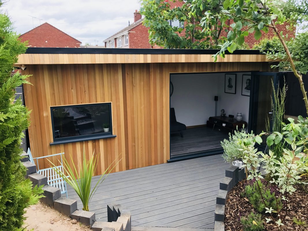 Garden office with sedum roof and bi-fold doors manufactured and installed by Viking Garden Buildings in Stafford