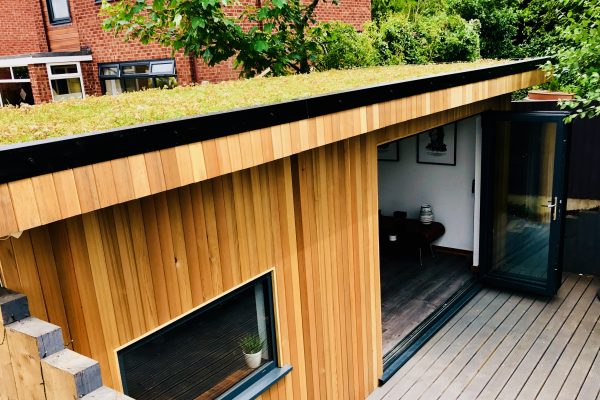 Garden office with sedum roof and bi-fold doors manufactured and installed by Viking Garden Buildings in Stafford