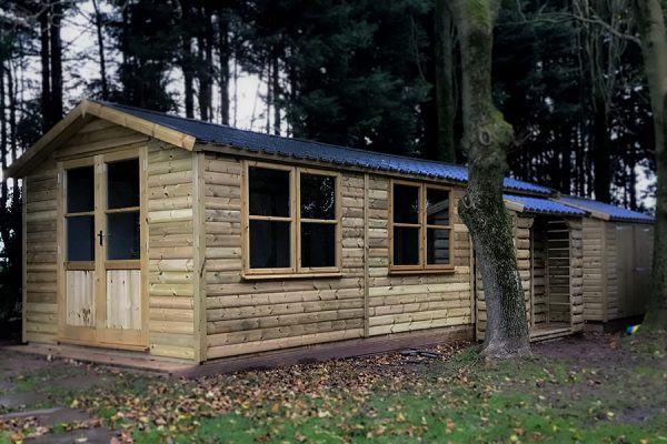 Large garden building with wood storage area built and designed by Viking Garden Buildings