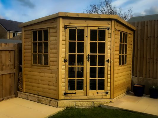 Traditional Corner Summer house manufactured and installed by Viking Garden Buildings in Stafford